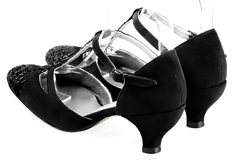 Gloss black women's T-strap open side shoes. Round toe. Medium spool heels. Rear view - Florence KOOIJMAN